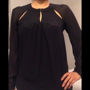 Black blouse with sheer sleeves